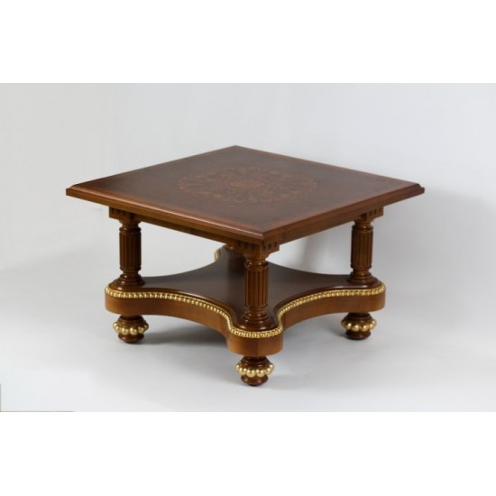 A small wooden table - an antique stool.